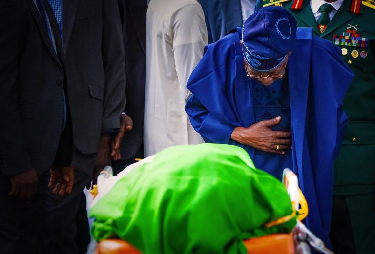 Read more about the article Tinubu Bows Before Buhari’s Remains At Daura Funeral